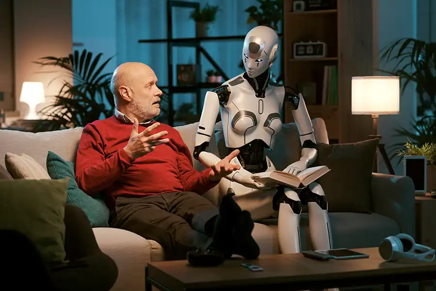 An elderly man sitting next to an AI robot on the couch. They are discussing ideas for his upcoming novel. The AI robot is holding a novel open while the elderly man is talking with his hands.